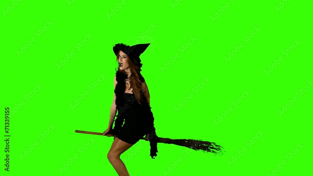 Halloween witch flying on a broomstick green screen Halloween witch flying on a broomstick green screen