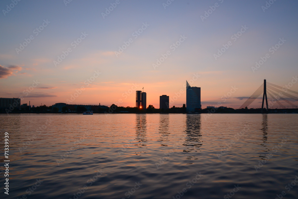 Sunset at quay - sun ray through building