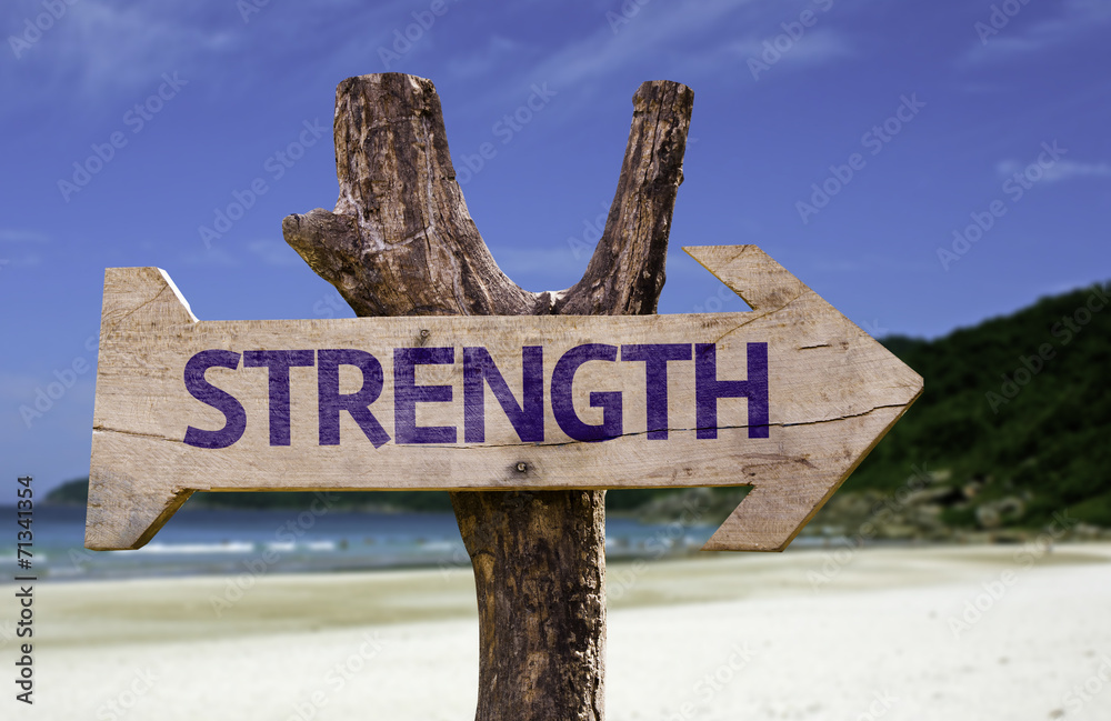 Strength wooden sign with a beach on background