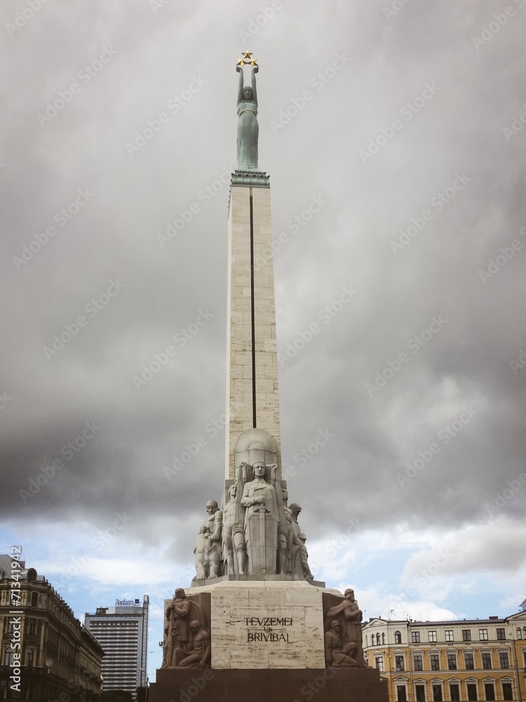 freedom monument in riga latvia with atorm clouds behind