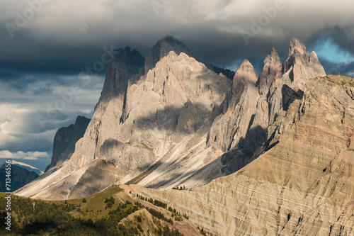 sunset over Geisler group mountains in Dolomites photo