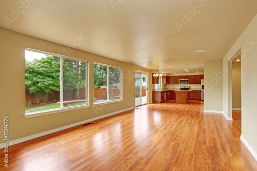 Фотография Empty house interior with new hardwood floor