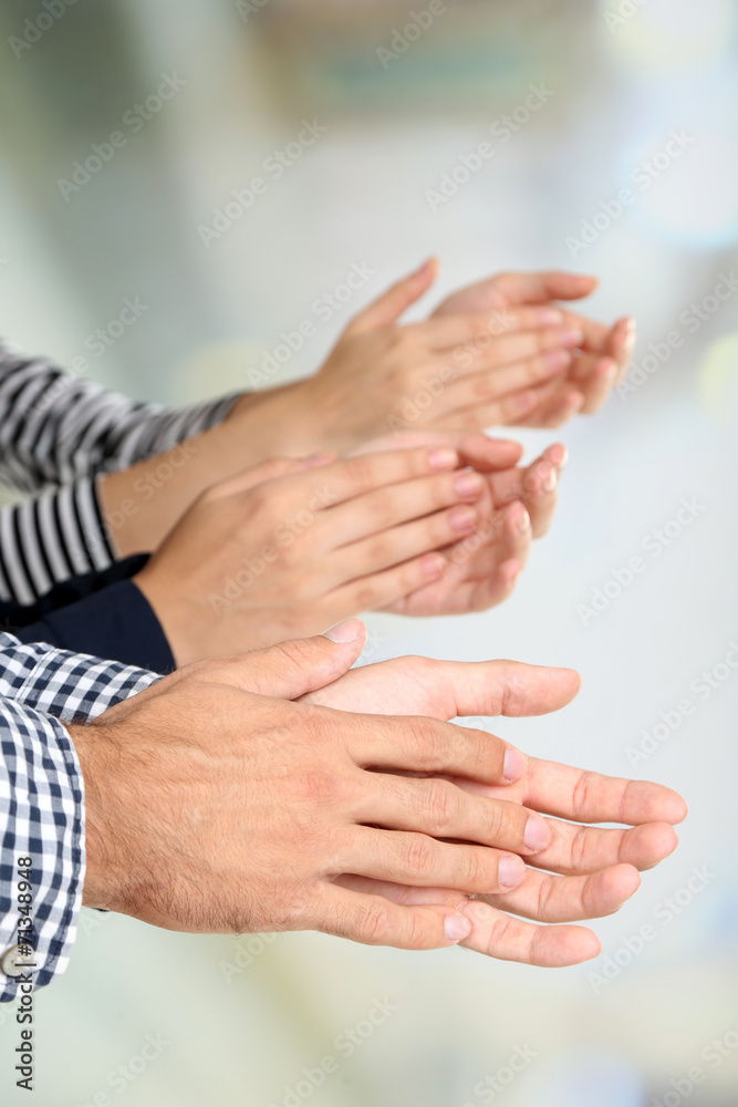 Fototapeta premium Clapping hands on bright background