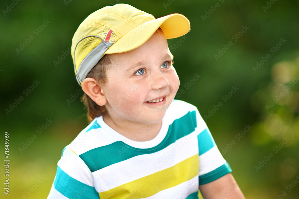 Portrait of cute little boy  in summer