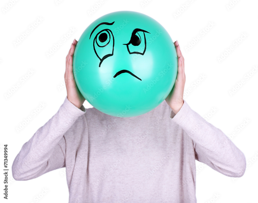 Woman holding balloon in front of her face Stock Photo | Adobe Stock