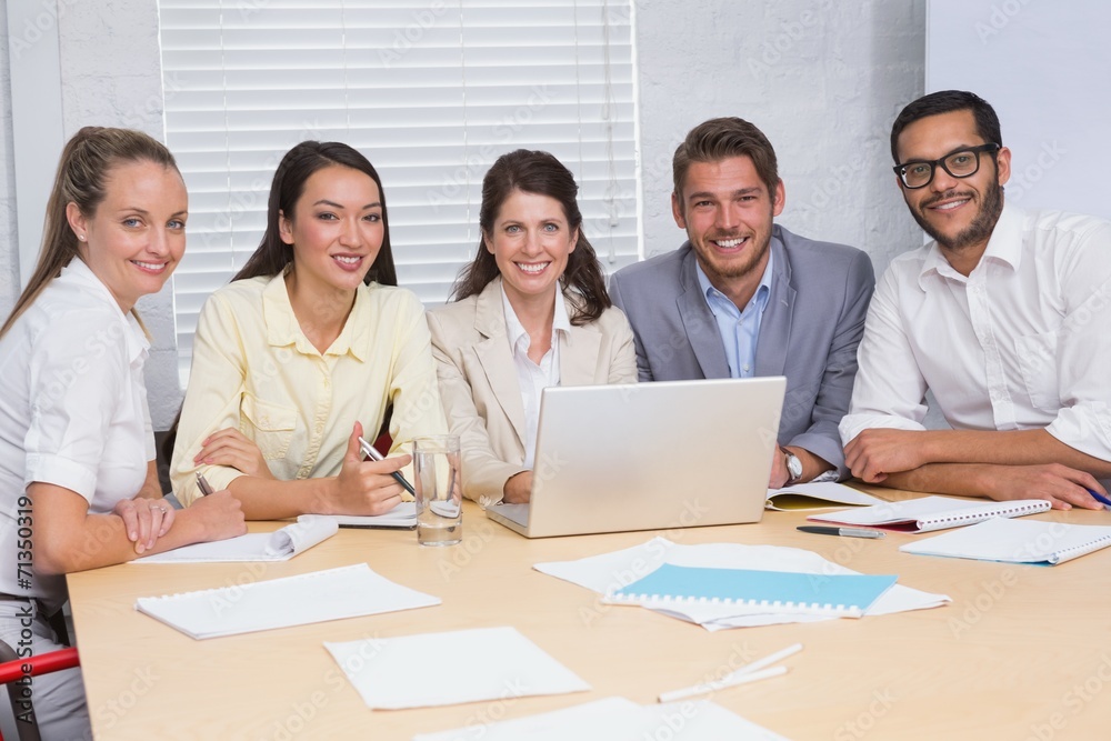 Casual business team having a meeting using laptop Casual business team having a meeting using laptop