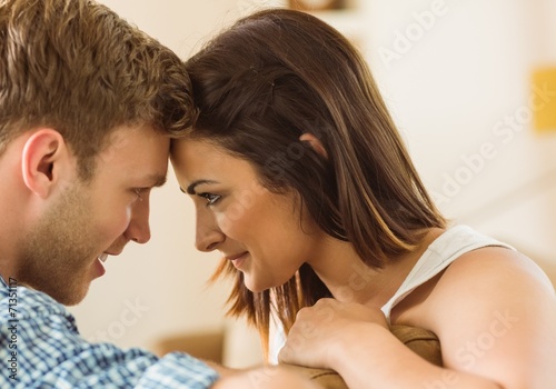 Happy young couple relaxing on the couch