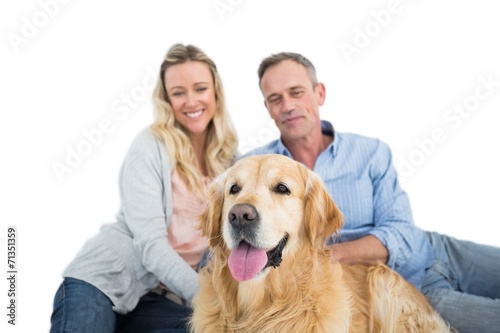 Relaxed couple with pet dog