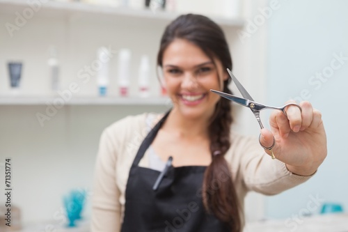 Cheerful hairdresser looking at camera