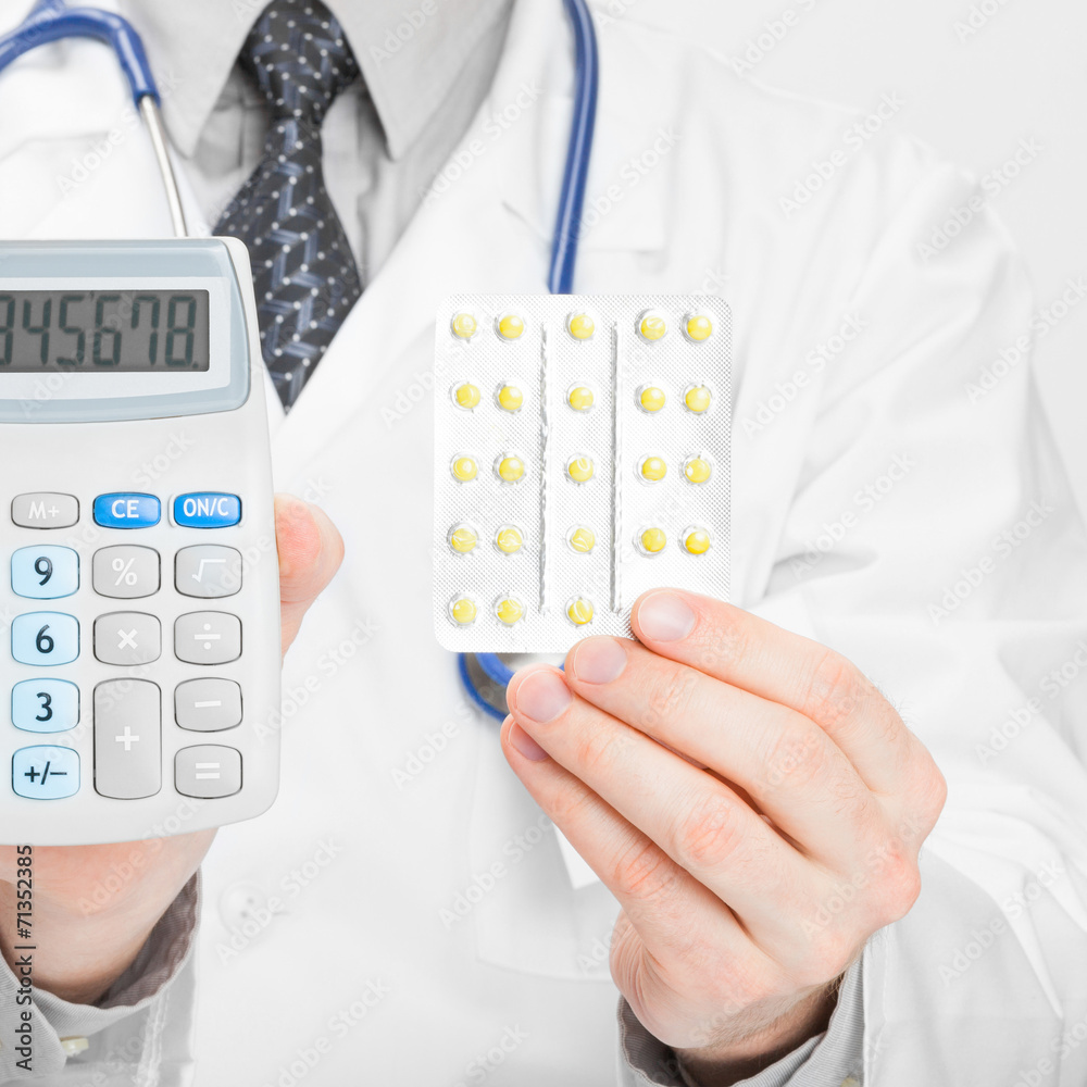 Doctor with calculator and pills in hands - 1 to 1 ratio Doctor with calculator and pills in hands - 1 to 1 ratio