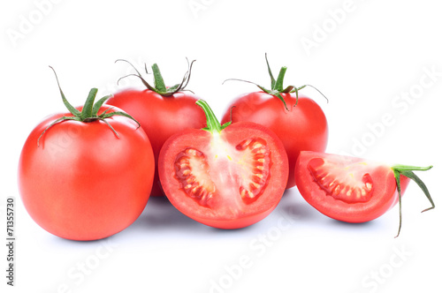 fresh red tomatoes with green leaf isolated on white background