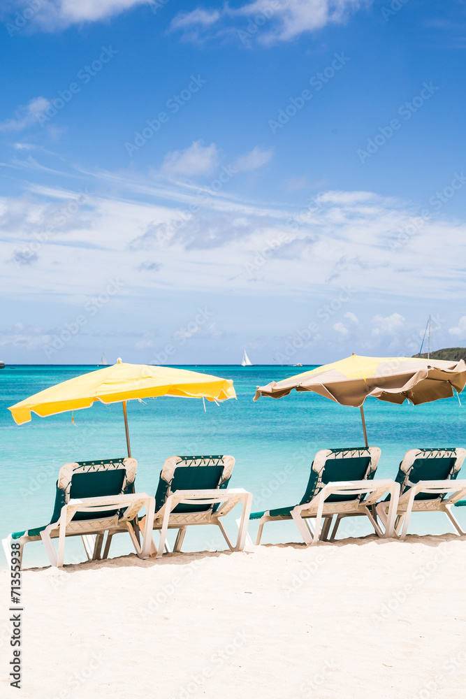 Green Chaise Lounges on Beach