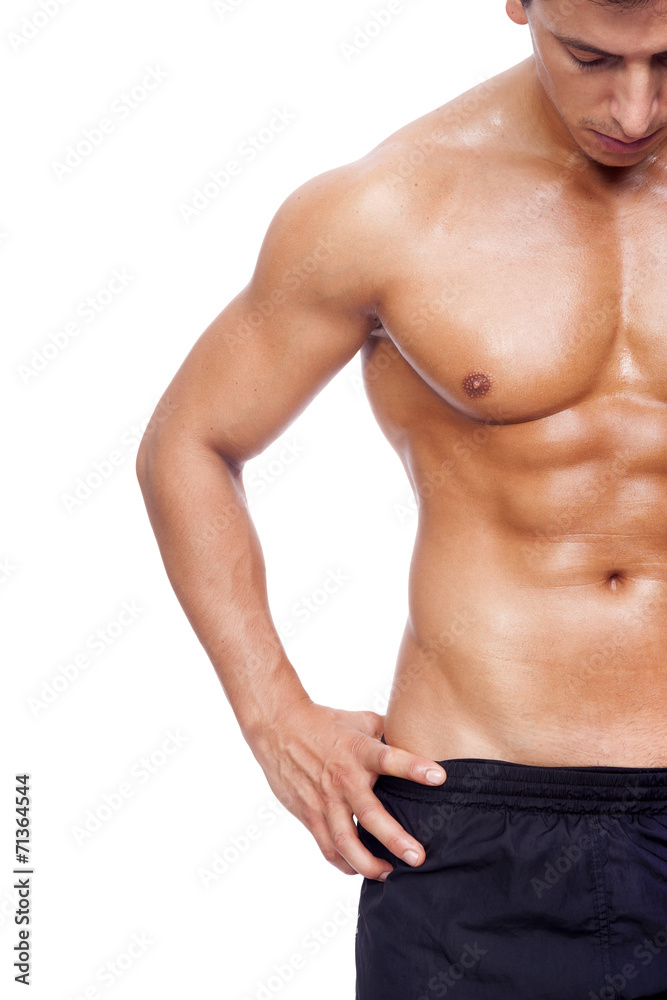 Fit young man with beautiful torso, isolated on white background