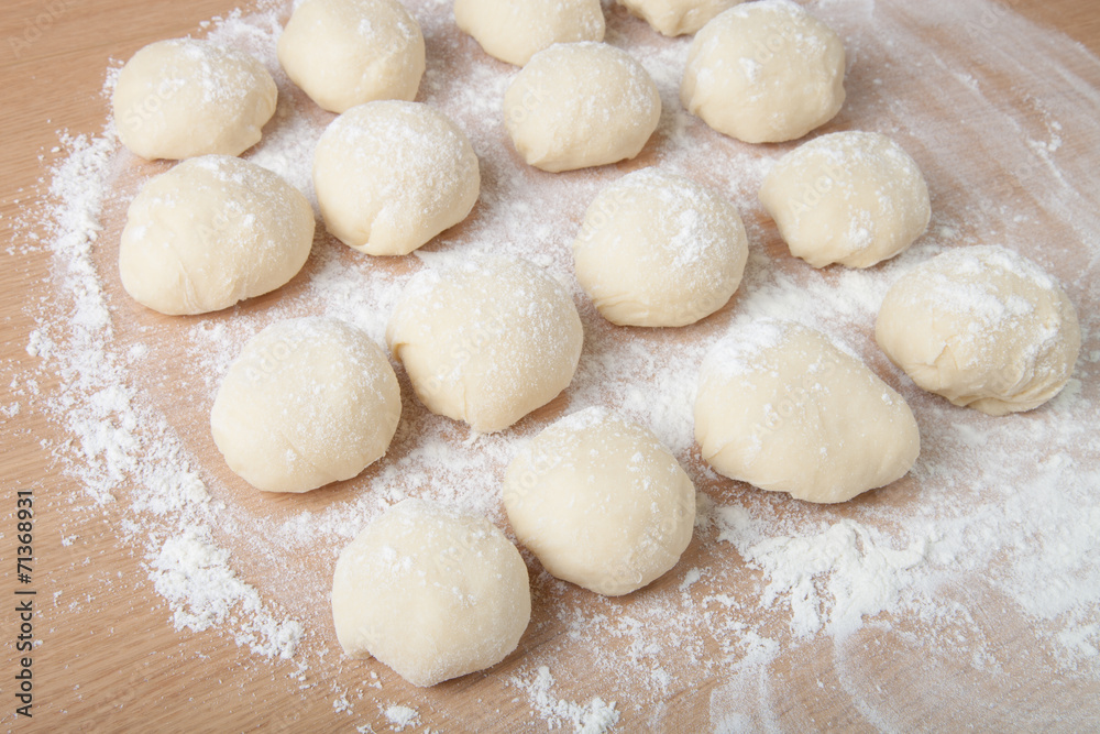 Small balls of dough with flour for pizza or cakes and scones. S