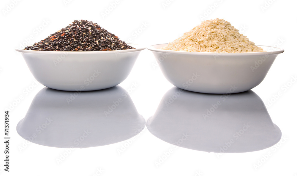 Black and white glutinous rice in bowl over white background Black and white glutinous rice in bowl over white background