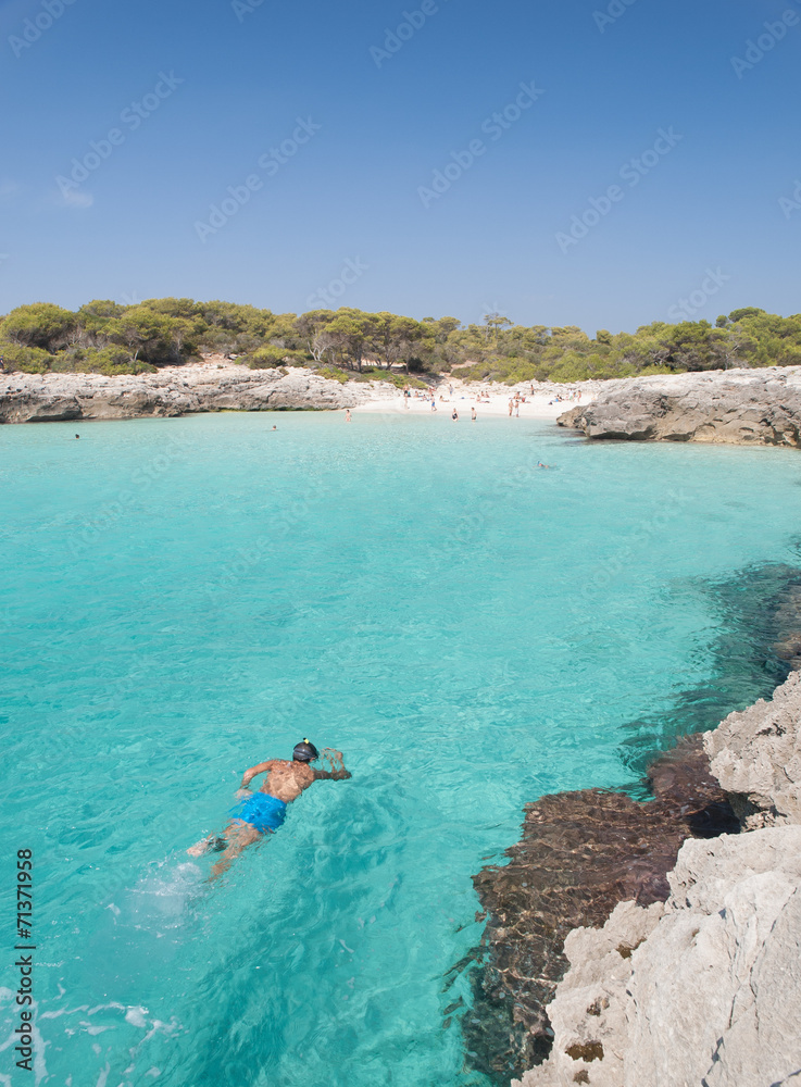 Snorkeling in a beautiful cala in Minorca.