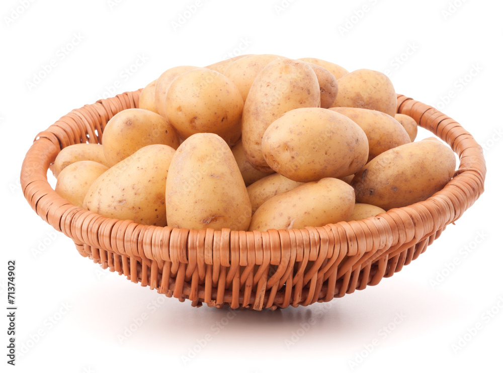 Potato tuber in wicker basket isolated on white background Potato tuber in wicker basket isolated on white background