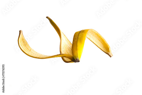 Banana peel floating on air against a white Background photo