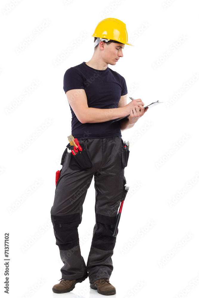 Construction worker taking a note. Construction worker taking a note.