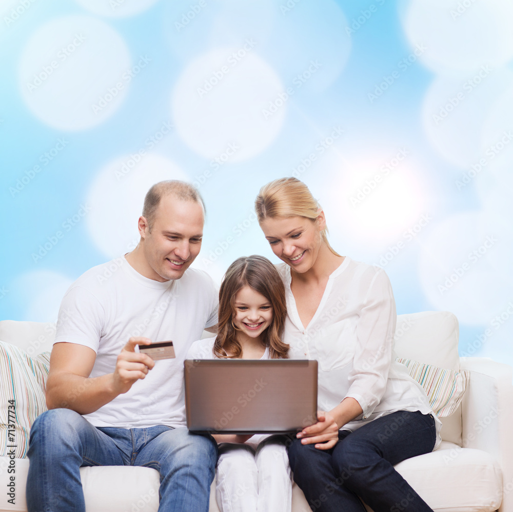 happy family with laptop computer and credit card happy family with laptop computer and credit card