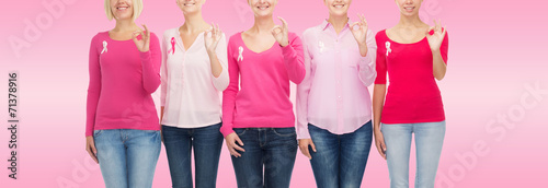 close up of women with cancer awareness ribbons