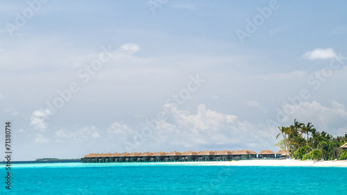 Fototapeta Naklejka Na Ścianę i Meble -  View of the coast of irufushi island with a bungalows, maldives