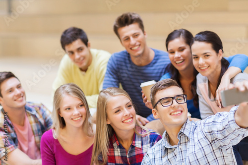 group of students with smartphone and coffee cup