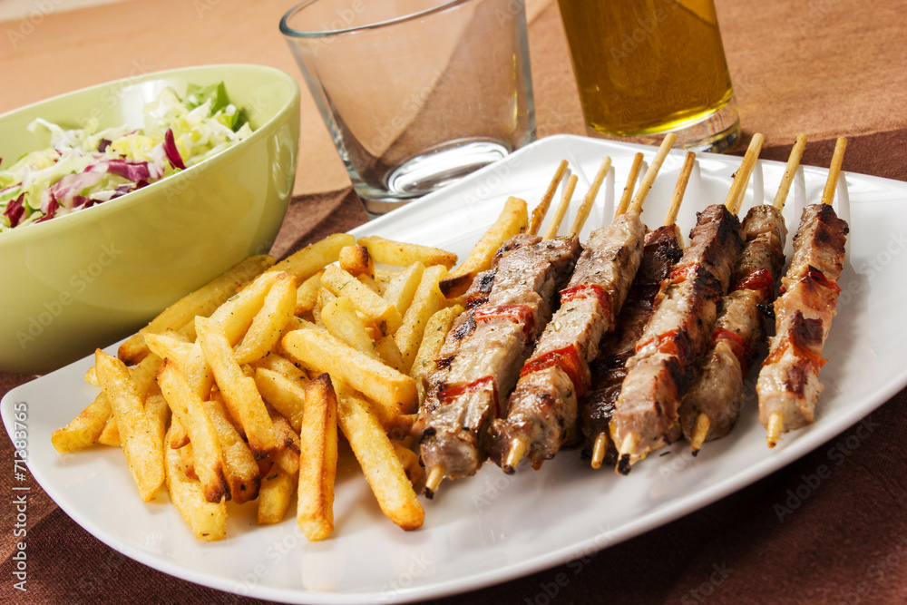 Pork skewers with french fries Pork skewers with french fries