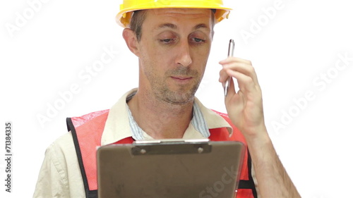 Male Worker With Clipboard Rubbing Head