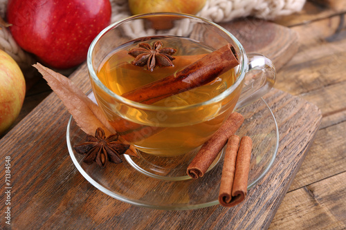 Composition of apple cider with cinnamon sticks, fresh apples,