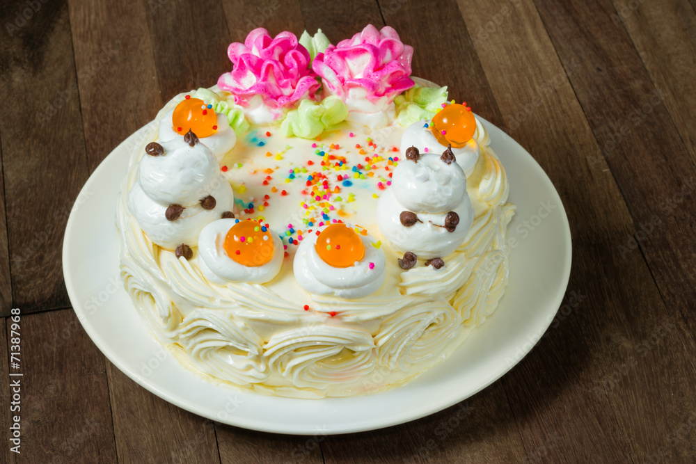 Cream cake with orange Jelly on the wooden table Cream cake with orange Jelly on the wooden table