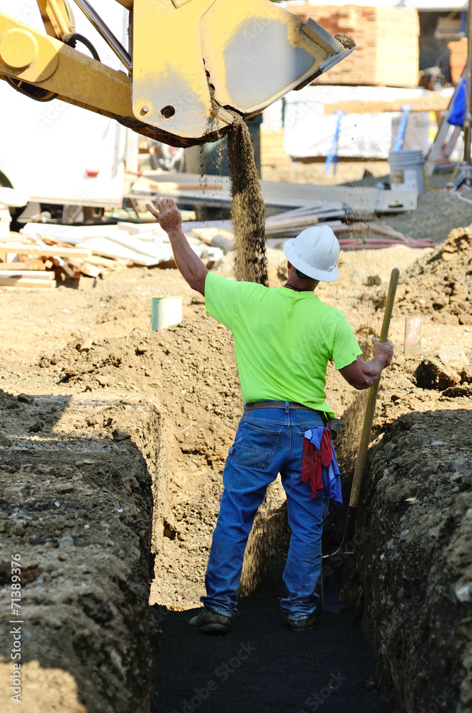 Trench Work worker in a utilities ditch