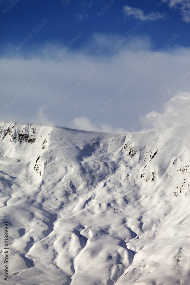 View on sunlight off-piste slope