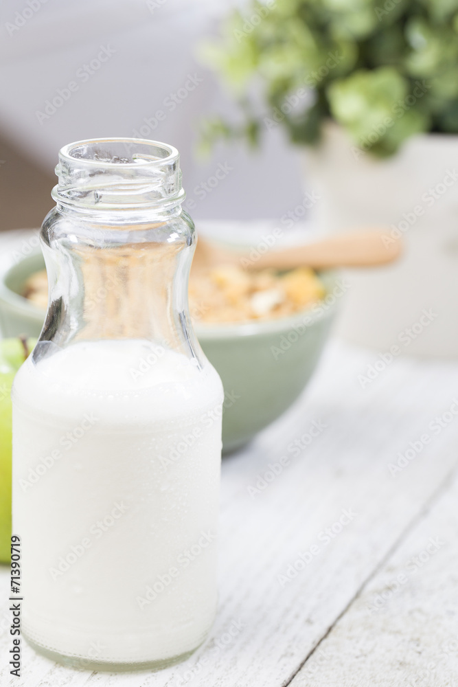 Bottle of milk, cornflakes on the table Bottle of milk, cornflakes on the table