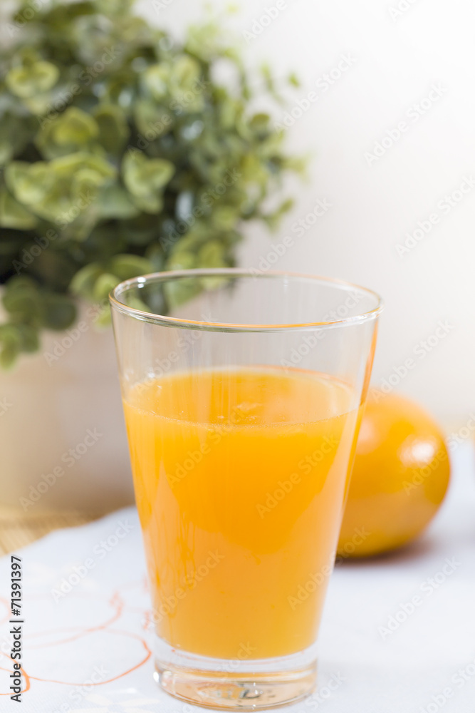 Glass of orange juice and orange