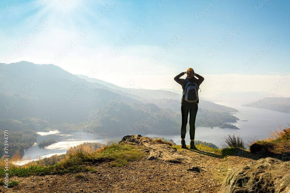 Obraz premium hiker on top of the mountain enjoying view, Ben A'an, Scotland
