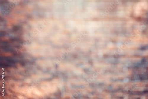 wall from bricks in bokeh( lens blurred) photo