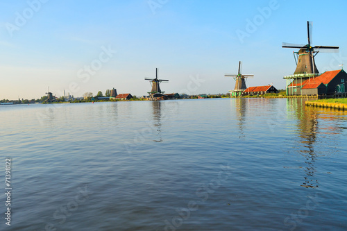 Dutch windmills in the summer and a lake