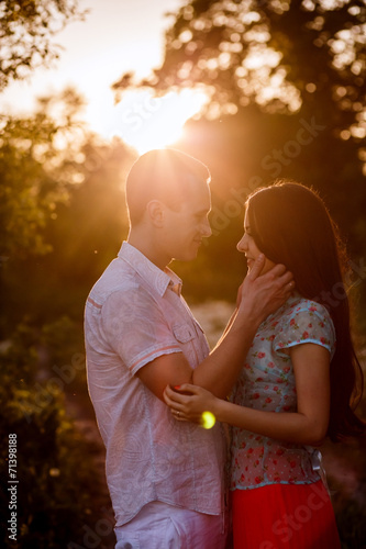 beautiful happy couple outdoors at sunset