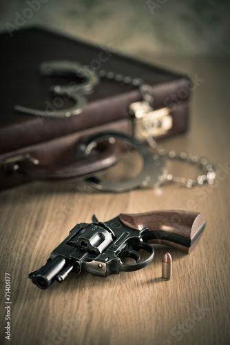 Handcuffs and revolver