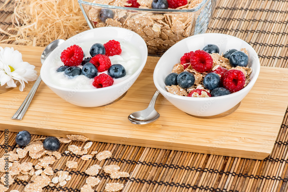 Bowls with berries, muesli and yoghurt Bowls with berries, muesli and yoghurt