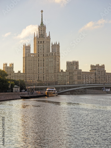 Moscow city center highrise tower on the sunrise and yacht in th