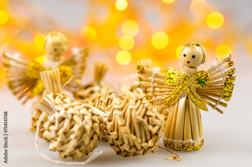 six straw christmas balls and two angels on white background wit six straw christmas balls and two angels on white background wit
