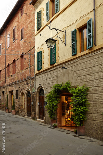 Fototapeta Naklejka Na Ścianę i Meble -  Old small stone medieval street in historical town, Italy