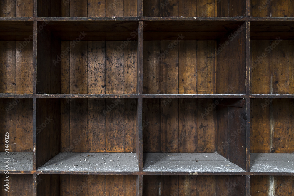 Naklejka premium Old, distressed, empty wooden storage shelves
