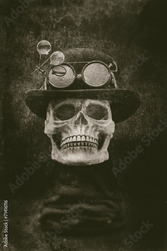 Steampunk halloween skull with bowler hat and goggles grunge eff