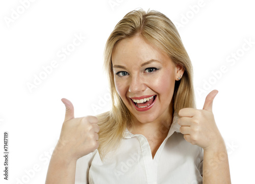 Young business woman with thumbs up