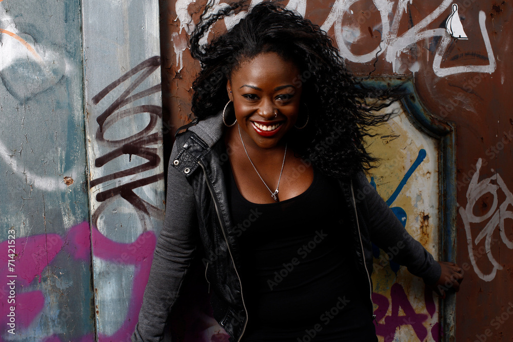 Naklejka premium Close up Happy Black Woman Posing at Wall