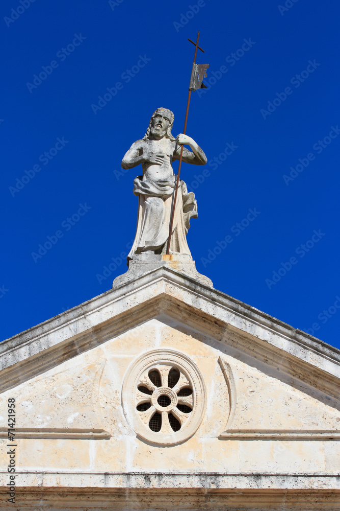 Venetian architecture and detail of church facade in Perast