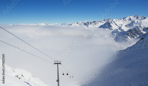 Cable car on the top of swiss mountains in Verbier photo